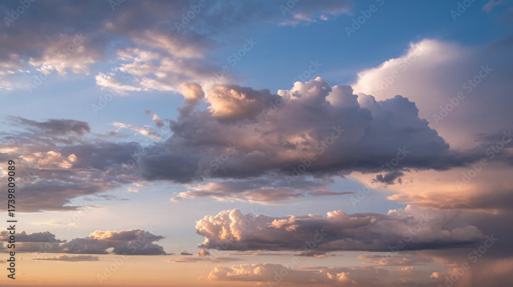 Fototapeta premium Golden Hour Sky with Layered Clouds and Warm Cinematic Glow