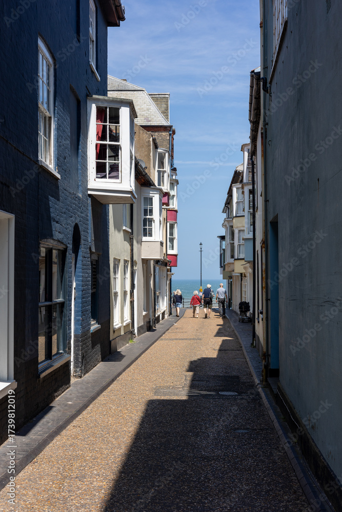 Fototapeta premium Very nice old street in Cromer, Norfolk, leading to the sea