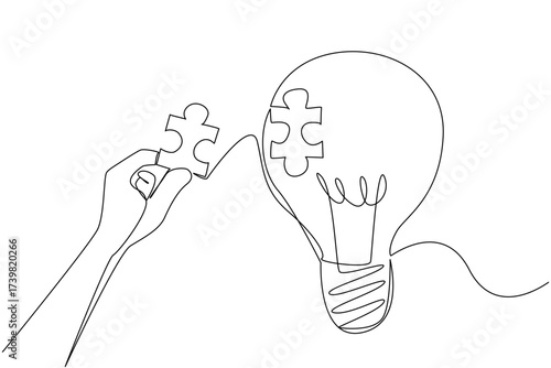 Single one line drawing hand holds puzzle piece and wants to stick it to the surface of hollow bulb. Patching the void of thought. National Creativity Day. Continuous line design graphic illustration