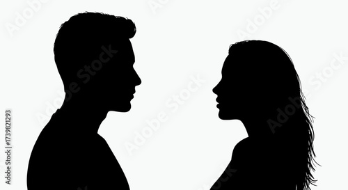 Silhouette of a man and woman facing each other in black and white