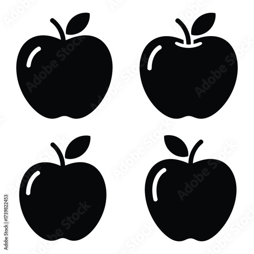 Four black silhouette apples with stems and leaves icon set graphic design element for food and health concepts silhouette
