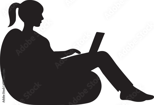 Silhouette of a young woman with her hair in a ponytail sitting comfortably in a beanbag chair and using a laptop computer