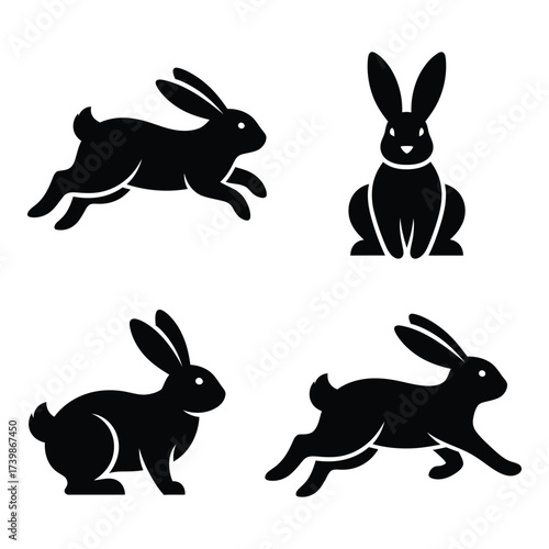 Four silhouettes of rabbits in various poses capturing movement and static stance for digital or print applications silhouette
