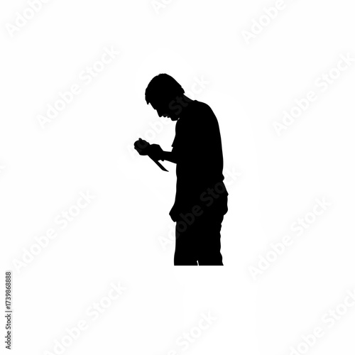 Man sharpening knife silhouette isolated on white background
