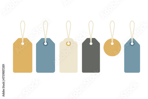 Set of blank hanging tags in various shapes and muted colors suspended by strings