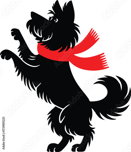 A playful black dog stands on hind legs with a red scarf