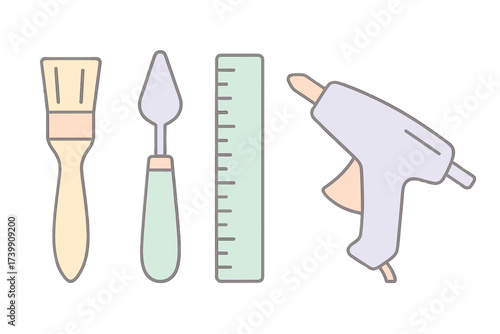 Set of crafting and DIY supplies featuring a paintbrush, palette knife, ruler, and hot glue gun