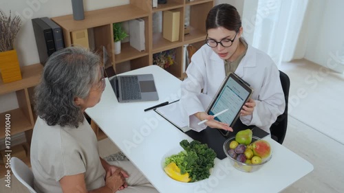 Nutrition consultants provide relaxed guidance on senior nutrition plans with AI charts, personalized recommendations, and a bowl of fresh fruits and vegetables to support a balanced diet.