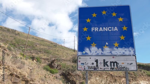 Crossing into France: Roadside View of the 'Francia' Sign from Catalonia