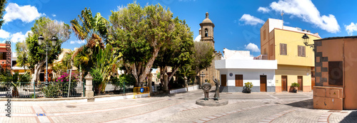 Картината върху платно Historic center of Agüimes with the bell tower of San Sebastián Church and a cha