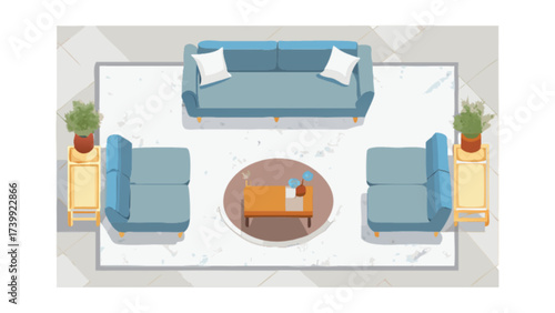 Overhead view of a living room setup with blue sofas, a rug, and a coffee table with decor items