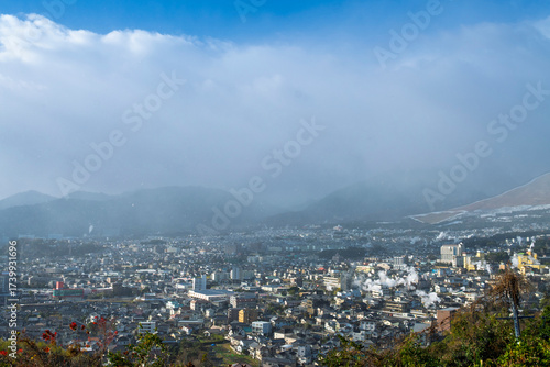Beppu cityscape with Steam drifted from public hot spring baths and ryokan onsen background, Beppu, Oita, Kyushu, Japan.