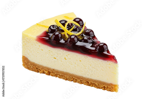 Isolated slice of decadent cheesecake with blueberries and a lemon twist as garnish