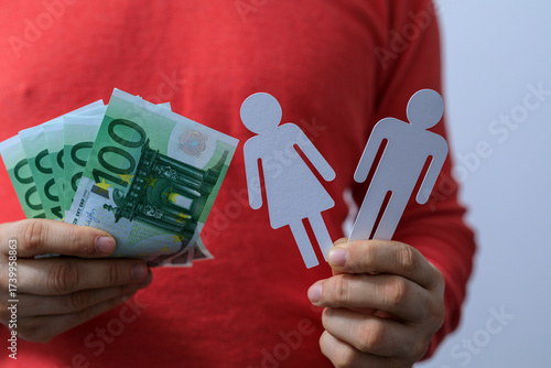 A person holding Euro bankn...