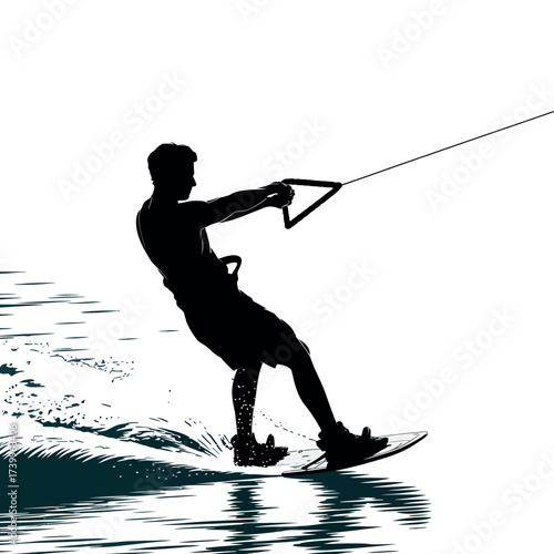 Silhouette of a man wakeboarding on a sunny day with water splashing