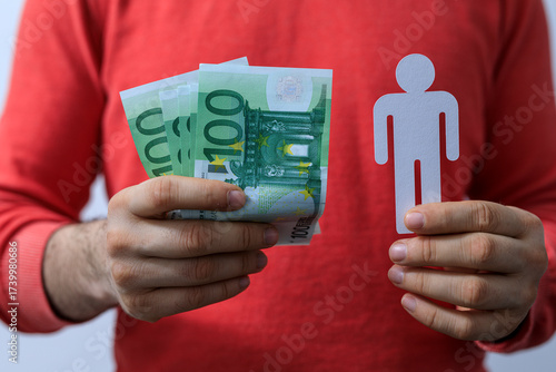 Person holding Euro banknot...