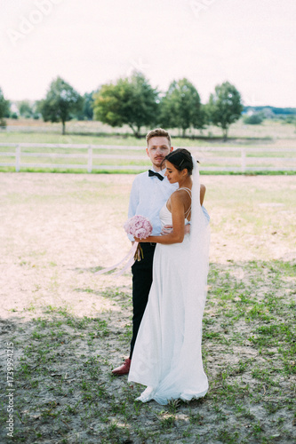 bride and groom hugging high quality photo