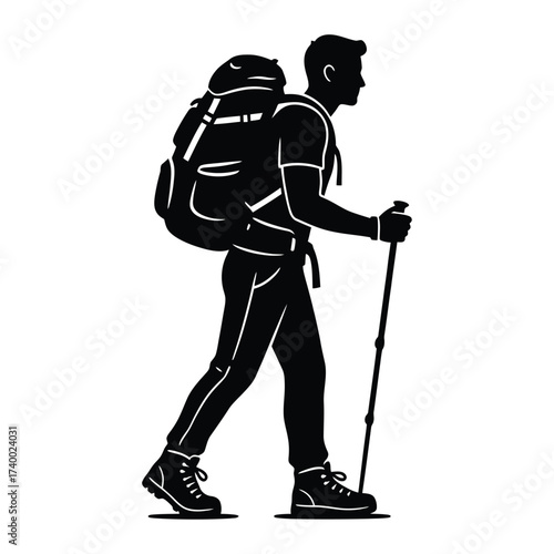 Silhouette of a hiker with backpack and trekking pole