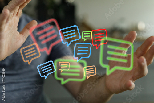 Digital communication concept. Human hands interacting with colorful glowing digital speech bubbles. Symbolic of connection and conversations.