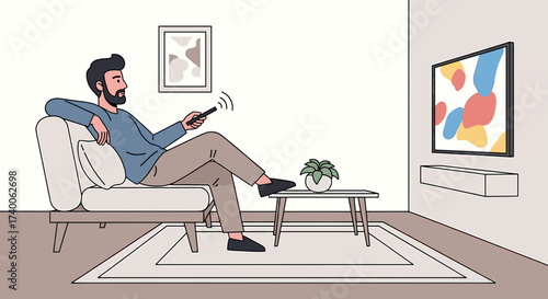 A bearded man relaxes on a sofa, pointing a remote at a television in a modern living room.