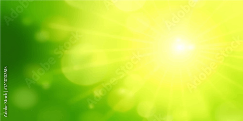 Bright abstract green nature background with sunny bokeh glow and star burst light