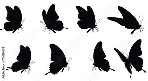 A collection of black silhouette butterflies in varying flight poses