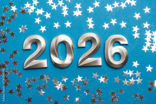 Metallic 2026 Numbers with Silver Star Confetti on Blue Background
