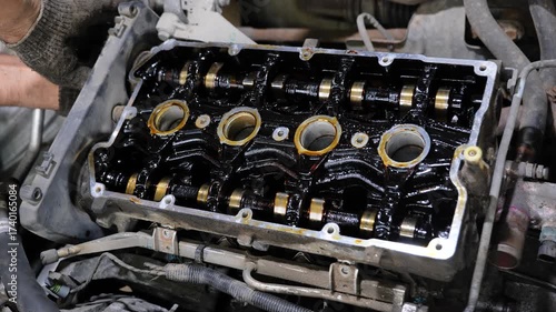 Mechanic working on car engine repair and maintenance