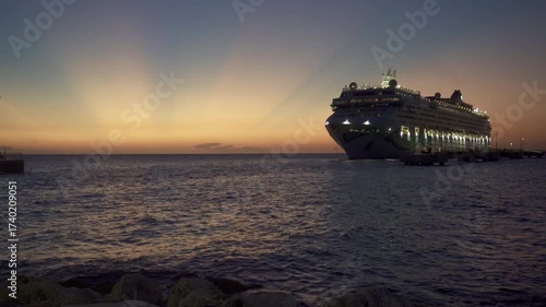Willemstad, Curacao: Norwegian Jade cruise ship in moored in Curaçao with a stunning sunset. Norwegian Cruise Line (NCL). Mega Cruise Terminal near Renaissance Park.