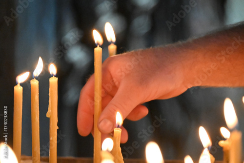candles in the hands of the man