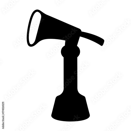 Silhouette of a black and white vintage microphone on a stand