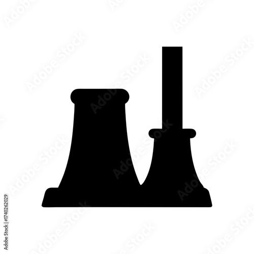 Silhouette of a power plant with a tall chimney and cooling tower