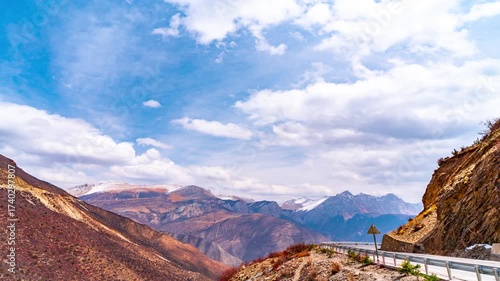 Time Lapse Truck Journey Through Nujiang River Mountain Valley with Dramatic Sky and Snow Peaks