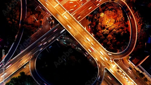 Overhead Time Lapse Shot of Urban Highway Overpass Traffic Intersection with Motion Blur Day to Night