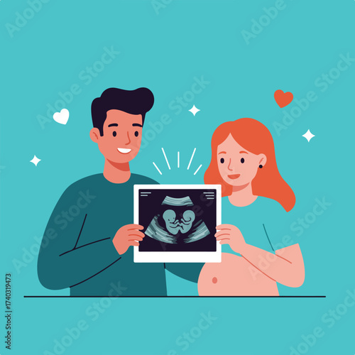 Happy couple holds ultrasound showing twin fetuses