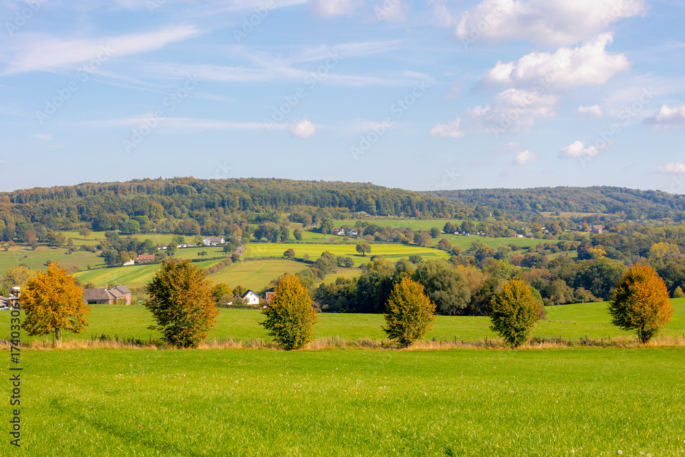 Obraz premium Autumn landscape, Terrain hilly countryside in Zuid-Limburg with a small villages on the hillside, farmland and forest, Epen is a village in southern part of the Dutch province of Limburg, Netherlands
