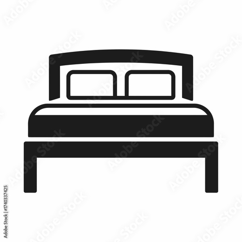Simple black graphic icon depicting a modern double bed with a headboard and two pillows, isolated on a white background.