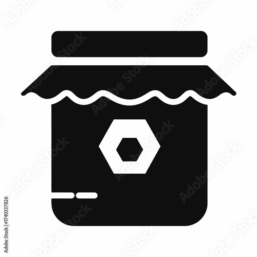 Black silhouette icon of a honey jar with a honeycomb symbol on its label, representing natural sweetness and bee products.