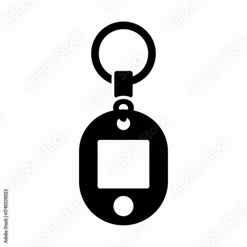 Black keychain with a circular ring and an oval-shaped tag with a square and a circle.