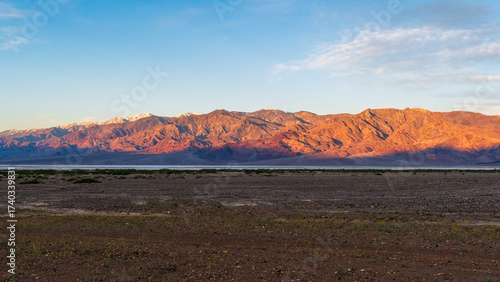 Sunrise View of Panamint Range across salt flats of Badwater Basin, Death Valley National Park