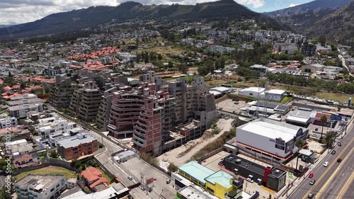 Stunning 4K aerial drone footage showcasing the beauty of Cumbayá city in Ecuador. This video captures sweeping views of the urban landscape, residential areas, lush green valleys, and the surrounding