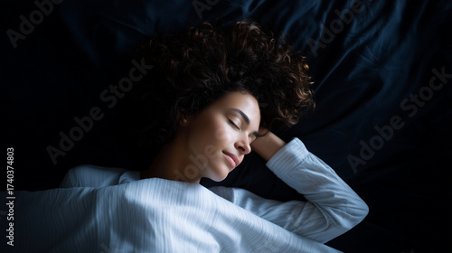 Top view of woman sleeping peacefully in dark bedroom, night wellness concept top view sleeping woman, dark bedroom night, peaceful sleep, wellness rest, sleep health concept, nigh