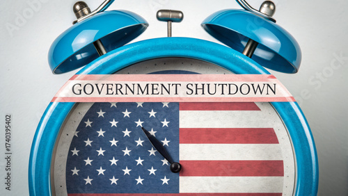 Budgetshutdowngovernmentfurlougheconomyusa alarm clock with american flag face and government shutdown headline urgent political concept