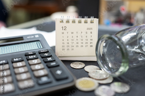 Monthly Expenses and Financial Struggles in 2025 DECEMBER. desk calendar DEC 2025. low income, and money not being enough to cover bills. budgeting, debt, and economic hardship.