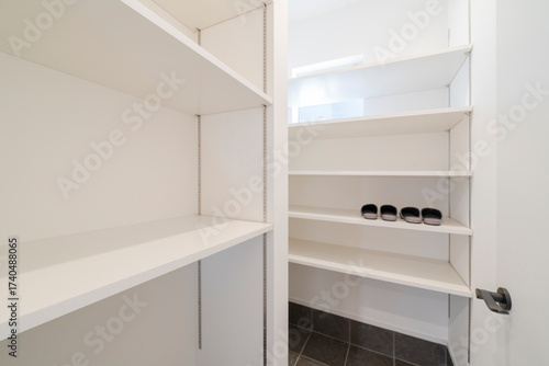 Bright storage space with open shelving system and window light, walk in closet, ウォークインクローゼット,シューズクローゼット