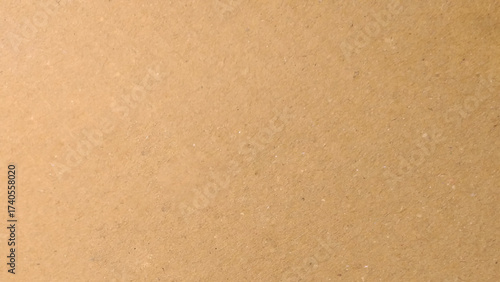 Old Kraft paper texture box craft stripes pattern. top view.
Abstract brown recycled paper background. 