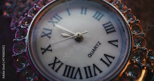 Wallpaper Mural Close Up of Decorative Clock with Roman Numerals with Ornate Jeweled Frame Showing Precise Time. Stylish Design Symbolizing Elegance, Luxury, Punctuality, Tradition. Symbolic Concept of Measuring Time Torontodigital.ca