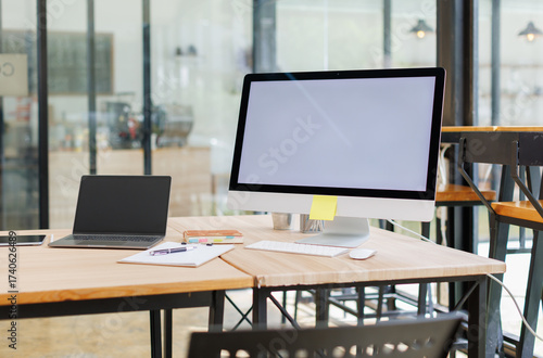 Wallpaper Mural Open desktop with blank screen view of a white-screen desktop computer mockup and accessories on a wooden desk in a workplace office room. private office, office workspace.

 Torontodigital.ca