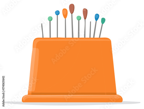 Close-up of an orange pincushion filled with colorful sewing pins and needles