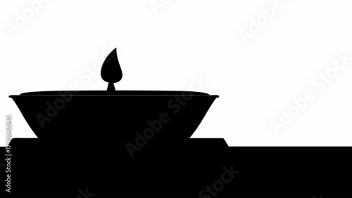 burning candle on black background